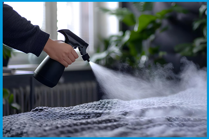 Application en spray d'huiles essentielles dans une chambre pour éloigner les punaises de lit